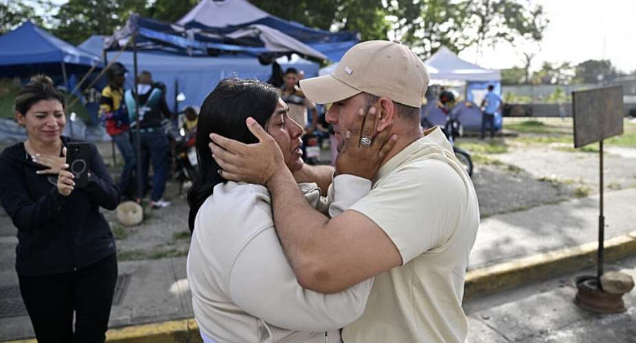 A former political prisoner reunites with a relative after being released outside El Rodeo I prison in Guatire, Venezuela. -  Juan Barreto, AFP