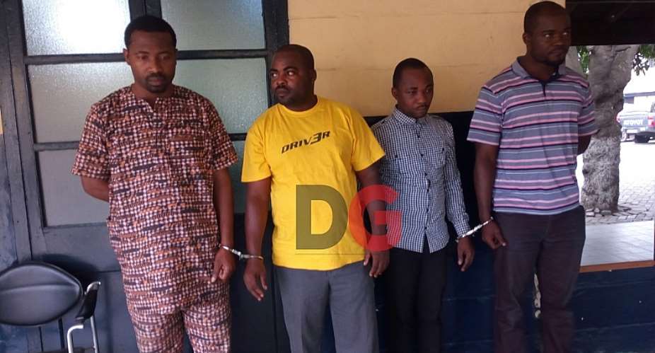 The suspected fraudsters in police custody