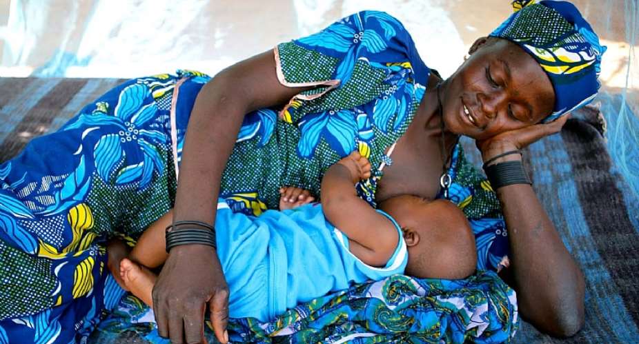 A mother breastfeeding her baby