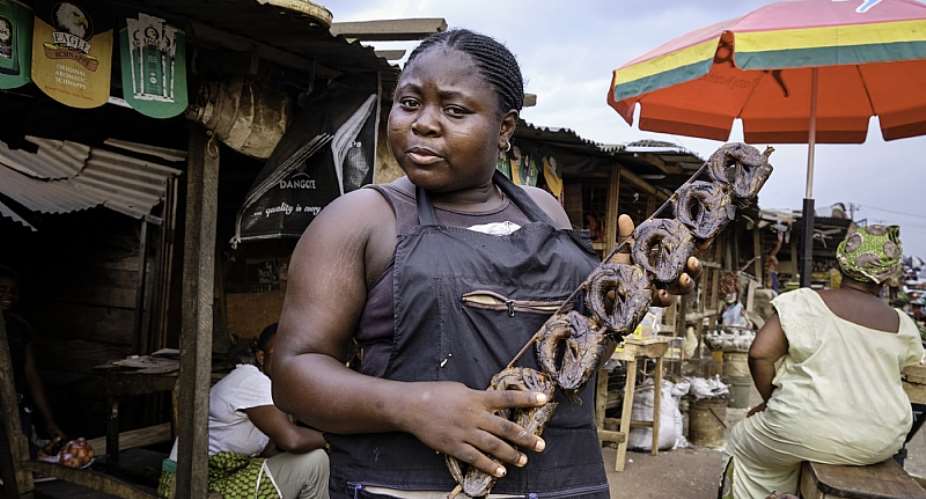 Woman selling dried fish at the Benin City market. - Source: Jorge FernndezLightRocket via Getty Images