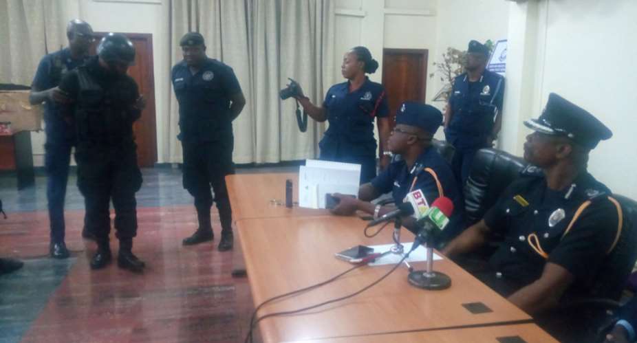 A private security guards paraded before DCOP Awini at the headquarters