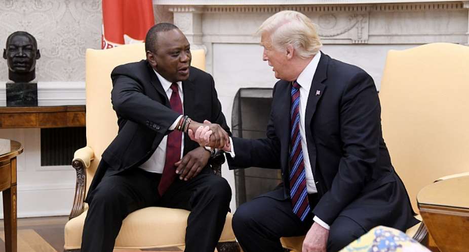 President Donald Trump shakes hands with Kenyan President Uhuru Kenyatta during a bilateral meeting in the Oval Office of the White House in August 2018.  - Source: Photo by Olivier Douliery-PoolGetty Images