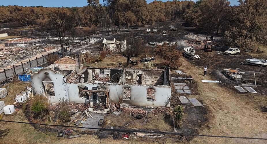 An aerial view of a home burned by a wildfire in Le Porge, southwestern France, Saturday, Aug. 1, 2026. -  Nicolas Garriga, AP