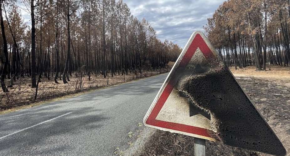 A burnt traffic sign on a road leading to Le Porge, following the devastating wildfires, 10 August. -  RFI/Jan van der Made