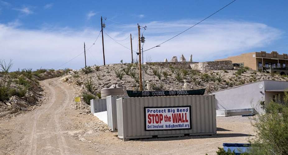 A protest sign is seen on a state road that leads into Big Bend National Park in southern Texas on August 15, 2026. -  Ronaldo Schemidt, AFP
