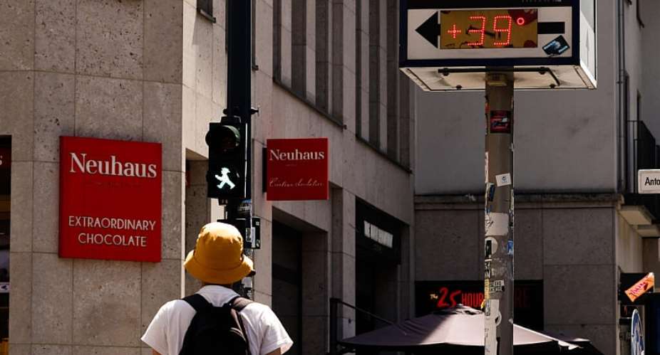 A thermometer installed near a chemist’s reads 39C in Berlin on Saturday 27 June 2026. - Carsten Koall/DPA via AP - Carsten Koall
