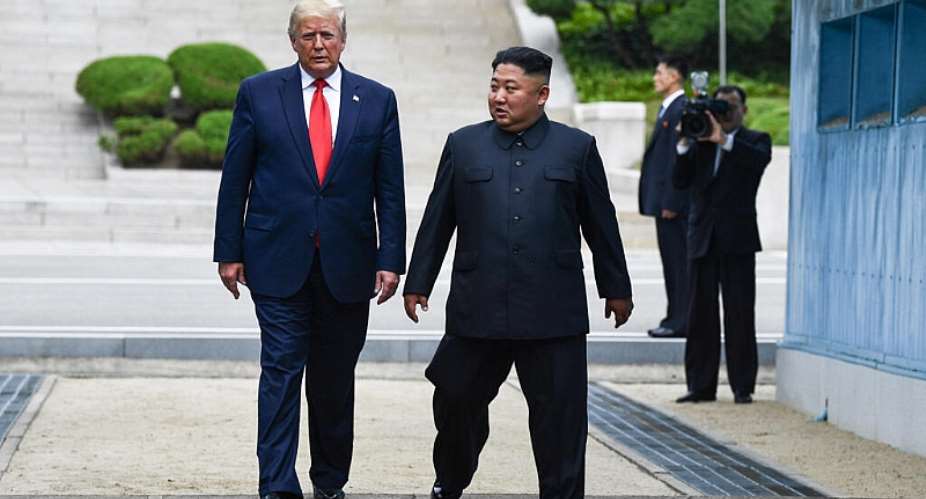 In this file photo, Trump walks alongside Kim Jong Un in the demilitarized zone of North Korea on June 30, 2019. -  Brendan Smialowski, AFP