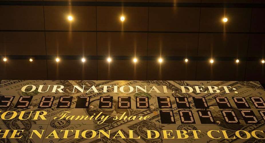 The National Debt Clock is displayed, Monday, April 7, 2025, in New York -  Yuki Iwamura, AP