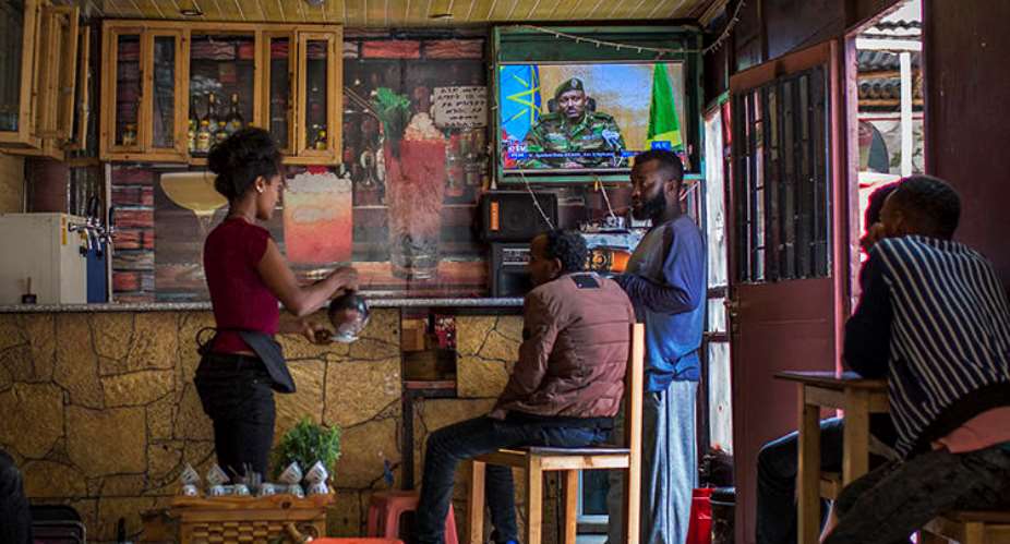 Ethiopians follow the news on television at a cafe in Addis Ababa, Ethiopia Sunday, June 23, 2019. Ethiopian authorities arrested journalist Mesganaw Getachew on August 9 after he filmed outside a court in Addis Ababa. AP PhotoMulugeta Ayene