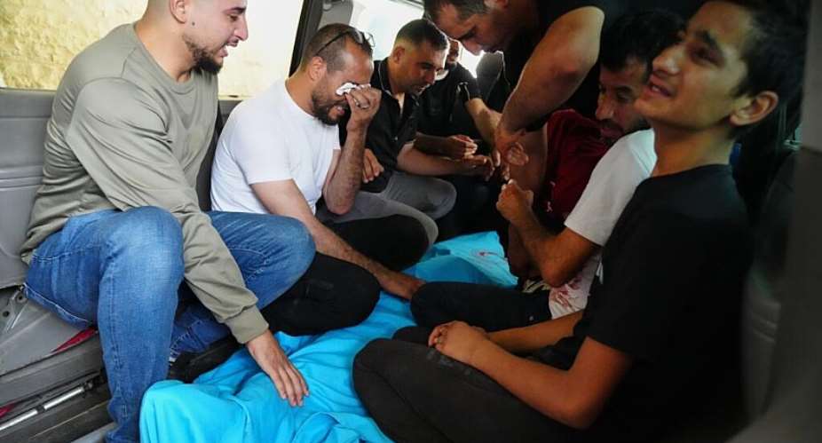 Relatives of Palestinian teenager Karim Shalaldeh, 17, cry over his body at a hospital in the West Bank city of Hebron, Friday, August 21, 2026. -  Mahmoud Illean, AP