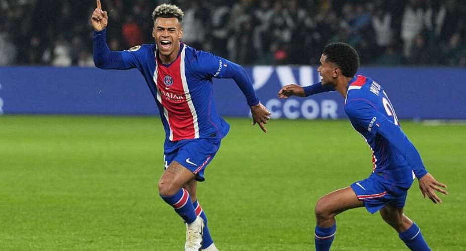 PSGs Desir Dou, left, celebrates scoring his sides opening goal during the French League One soccer match between Paris Saint-Germain and Brest in Paris, France, Sunday, May 10, 2026. - AP - Thibault Camus