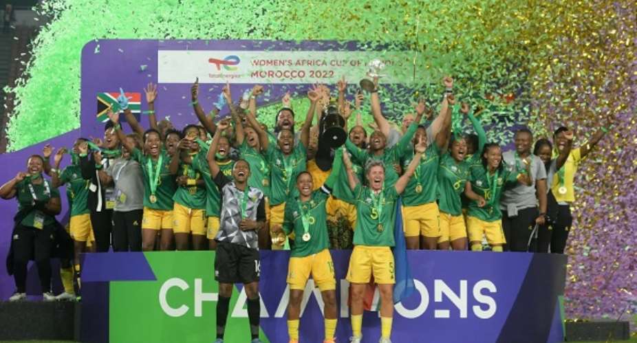 Players and officials of Banyana Banyana on cloud nine after winning thheir maiden WAFCON trophy