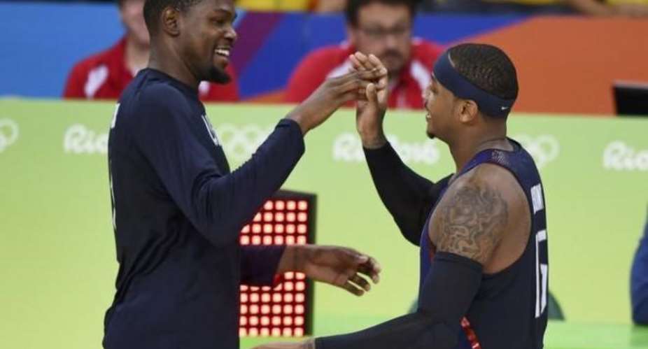 U.S. routs Serbia for third straight basketball gold Photos