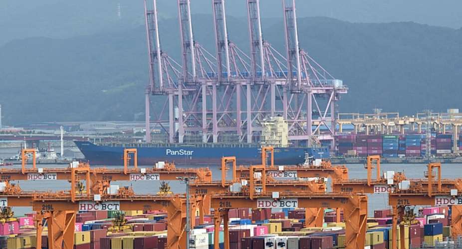 The container ship Panstar Acro is anchored at the new port of Busan before setting sail for Europe via the Arctic to test the commercial viability of the shipping route opened up by melting ice, in South Korea, on August 22, 2026. -  Jung Yeon-je, AFP