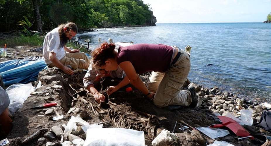 Archaeologists excavate the Anse-Bellay slave cemetery in Martinique in 2019. Coastal erosion is exposing former slave burial grounds across the French Caribbean while threatening to erase valuable historical evidence. -  Thomas Romon / Inrap