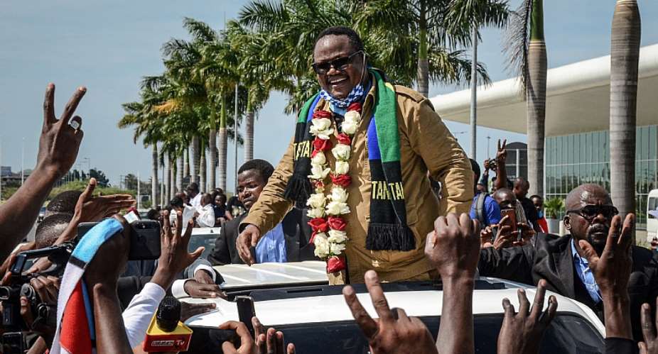 Tundu Lissu reacts to supporters as he returns home after three years in exile. - Source: