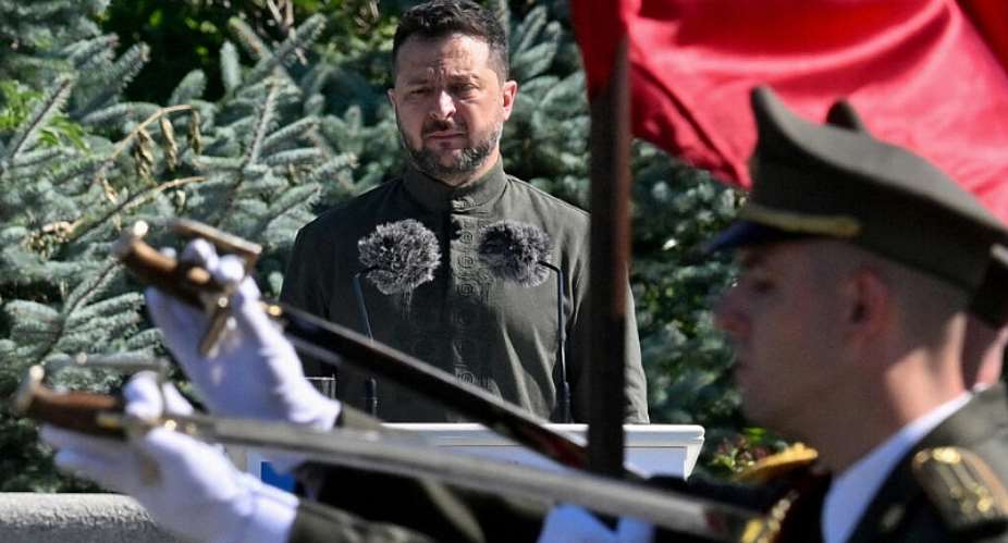 Ukraines President Volodymyr Zelensky stands in front of the Ukrainian guard of honor parade in Kyiv on August 23, 2026. -  Sergei Supinsky, AFP