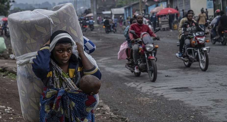People displaced by the fighting with M23 rebels make their way to the center of Goma, Democratic Republic of the Congo, Sunday, Jan. 26, 2025. -  Moses Sawasawa, AP