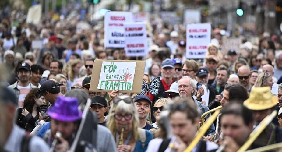 Protesters take part in a climate demonstration organized by the Swedish Society for Nature Conservation together with Rebel Moms, Rebel Dads and Researchers Desk in central Stockholm, Sweden, on August 23, 2026. -  Christine Olsson, AFP