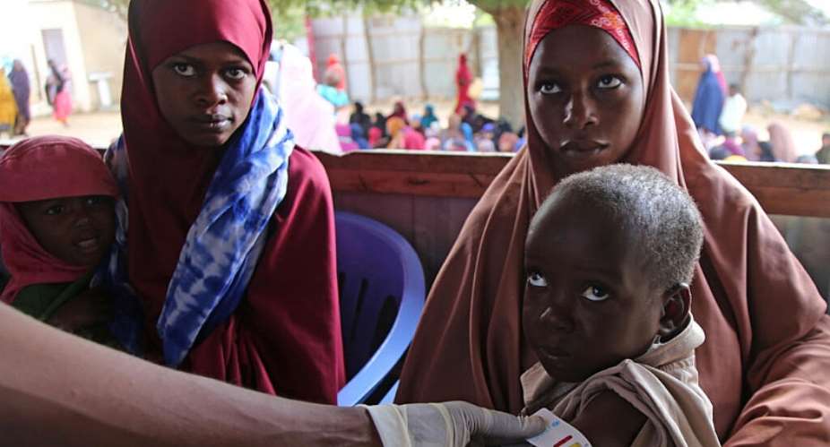A health worker measures a Somali baby for malnutrition at Feynuus Nutrition Centre on the outskirts of Mogadishu in August, 2026. -   Farah Abdi Warsameh / AP Photo