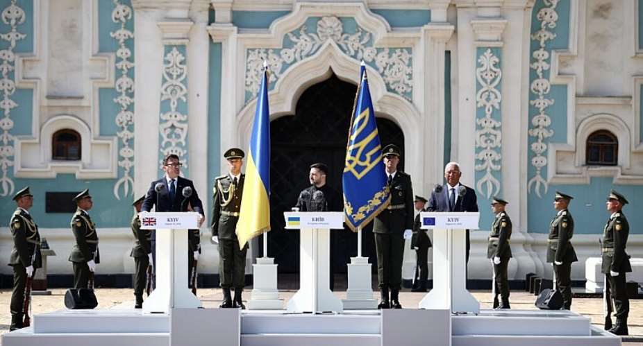 Britains Prime Minister Andy Burnham, centre left, Ukraines President Volodymyr Zelenskyy, centre, and European Council President Antonio Costa, centre right, attend a commemorative ceremony marking Ukraines 35th Independence Day outside St. Sofia cathedral in Kyiv, Ukraine, 24 August 2026. -  Henry Nicholls / Pool AFP via AP