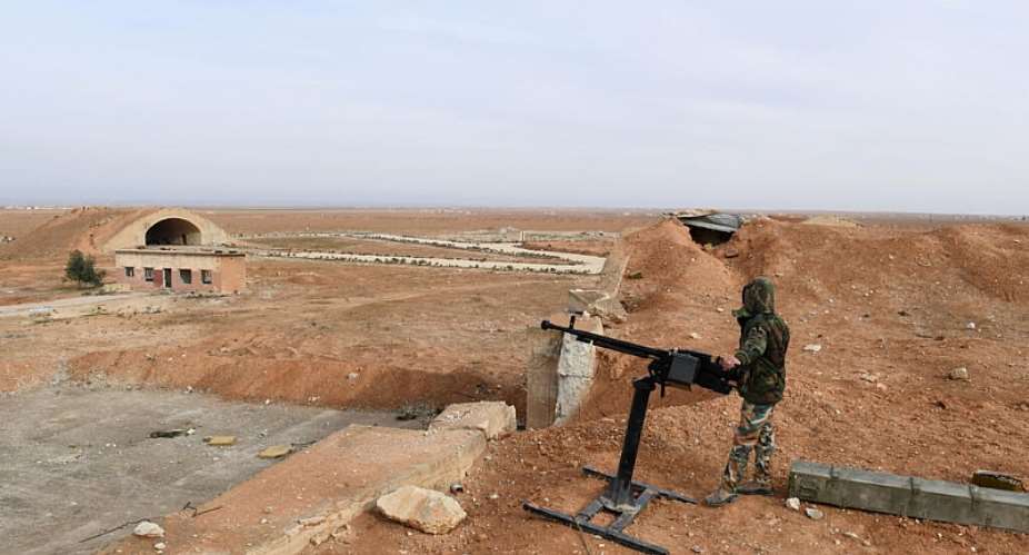 File - A member of Syrian government forces, stands guard the Abu Duhur military air base area in Idlib province, on January 21, 2018. -  George Ourfalian, AFP