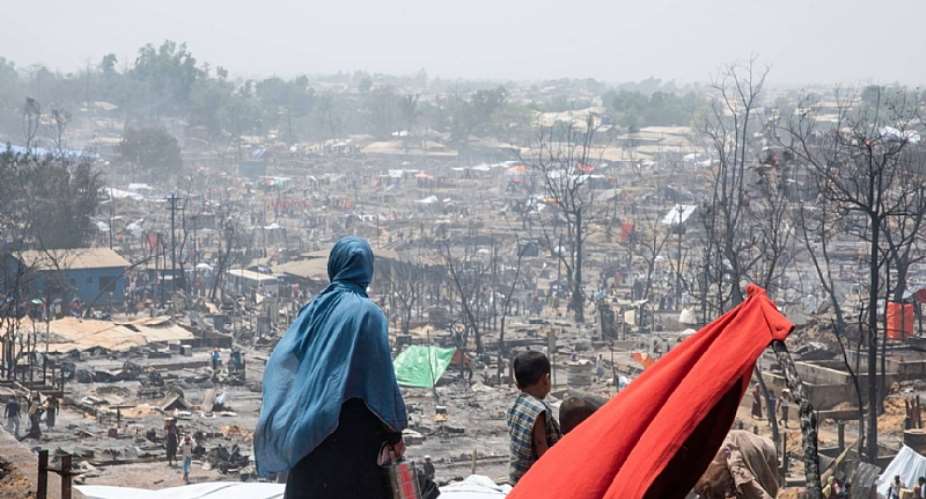 Rohingya refugees and humanitarians have faced unprecedented challenges in 2023, including fires, cyclones, and ongoing threats of monsoon-related disasters, putting their resilience to the test. Photo: IOM