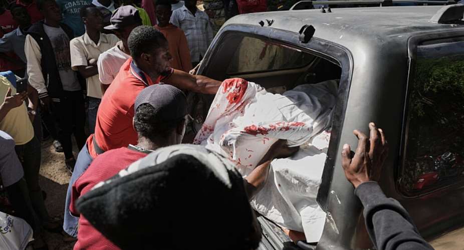 Morgue workers put the bodies of gang attack victims into an ambulance in the Kenscoff neighborhood of Port-au-Prince, Haiti, Aug. 24, 2026. -  Odelyn Joseph, AP