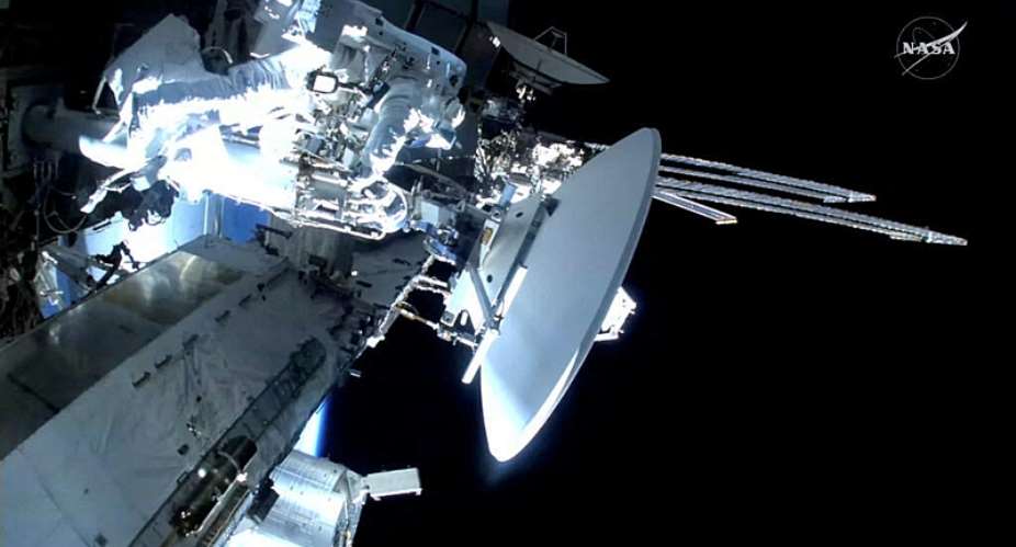 French astronaut Sophie Adenot performs a spacewalk to replace a space-to-ground antenna, assisted by US astronaut Anil Menon, outside the International Space Station, 18 August 2026. -  NASA via Reuters