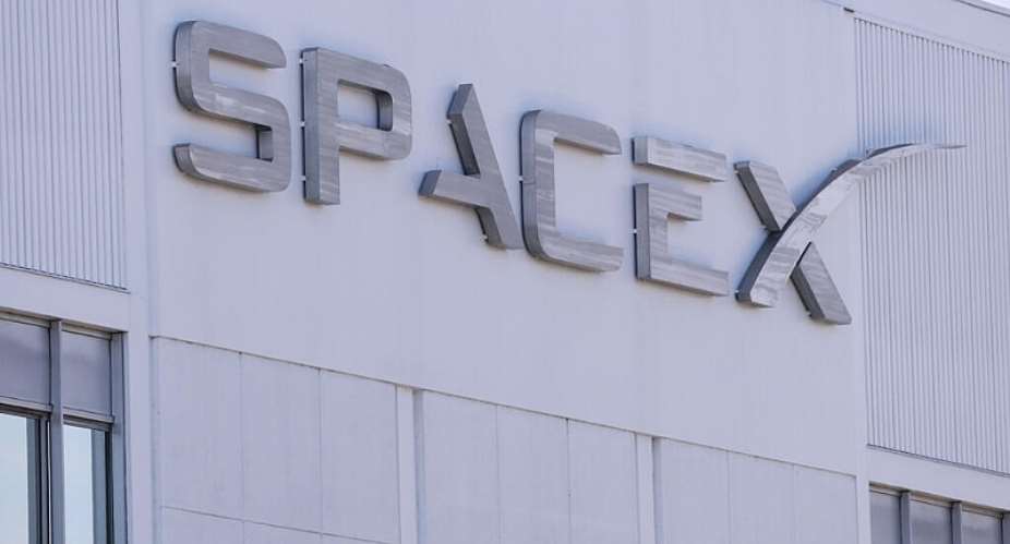 SpaceX signage is displayed outside a Space Exploration Technologies Corp. facility in Hawthorne, California in March 2026 -  Patrick T. Fallon, AFP