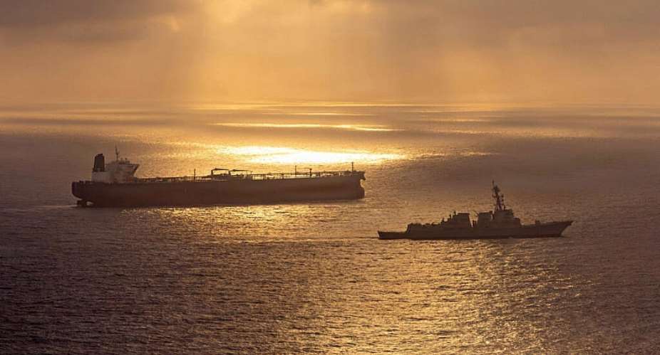 This US Navy handout photo released on May 8 shows the Arleigh Burke-class guided-missile destroyer USS Rafael Peralta (DDG 115) implementing a maritime blockade against the Iran-flagged crude oil tanker vessel Herby -  - / US NAVY/AFP