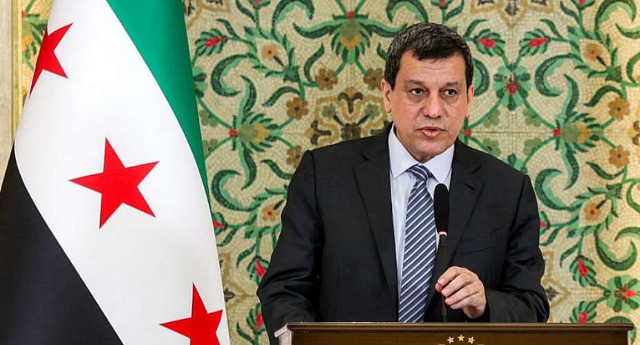Mazloum Abdi, leader of the Kurdish-led Syrian Democratic Forces (SDF), speaks during a televised speech at the Peoples Palace in Damascus on August 25, 2026. -  Bakr ALkasem, AFP