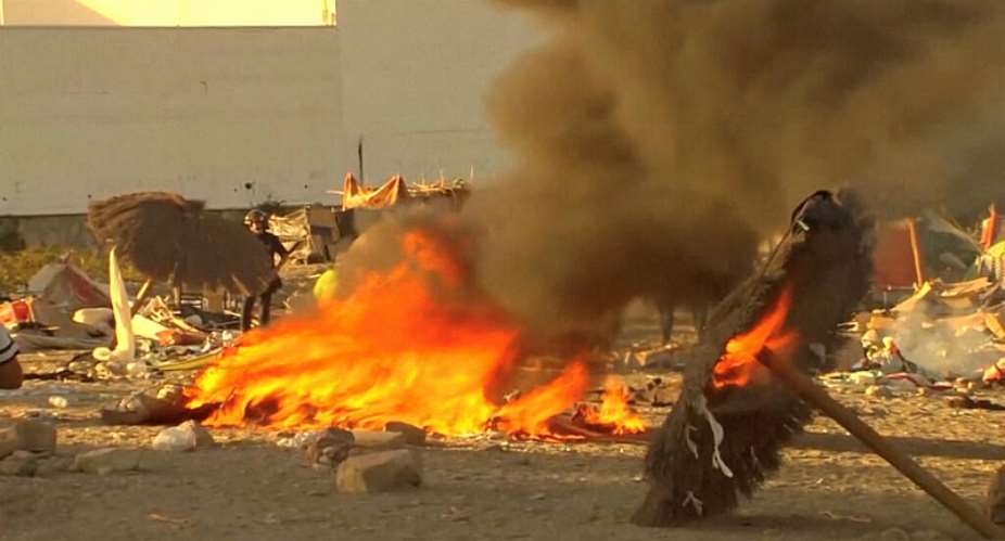Smoke and flames rise as Ceuta residents destroy a migrant camp by the beach in the Spanish North African enclave on August 27, 2026. -  Forta, Reuters