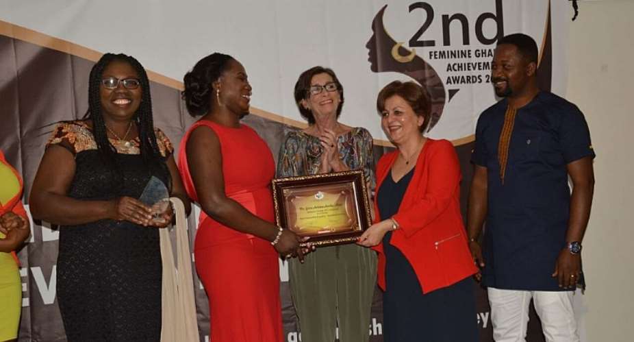 Mrs. Antwi left receiving her citation from the Turkish Ambassador to Ghana, H.E. Nesrin Bayazit. looking on are the Spanish Ambassador and some representatives from Sasso