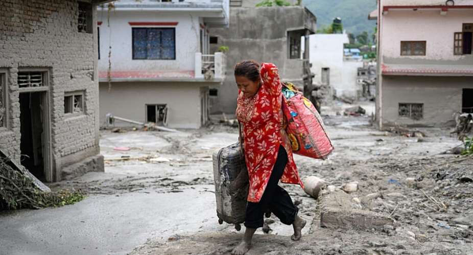 Flood survivors face an agonising wait to learn the fate of missing relatives, and the prospect of rebuilding their lives -  MANAN VATSYAYANA / AFP
