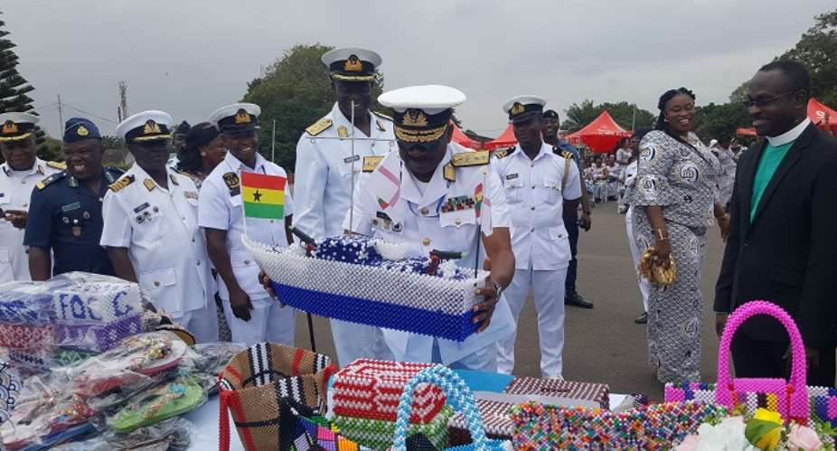 Chief Of Naval Staff, Rear Adm Seth Amoama inspecting some of the prod ucts