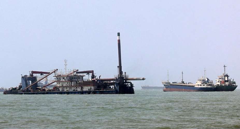 File photo of a vessel moving past a barge along the Strait of Hormuz off Bandar Abbas in southern Iran taken August 10, 2026. -  Atta Kenare, AFP