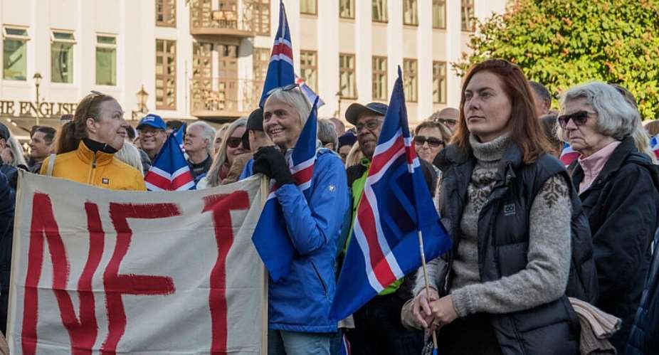 People holding a banner reading No in opposition to the resumption of European Union accession talks in Reykjavik, Iceland, 27 August 2026. - AP Photo/Marco Di Marco - Marco Di Marco