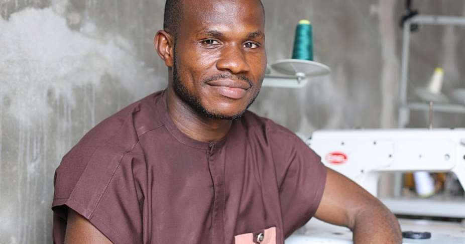 Ejike at his workshop in Ijegun Market Satellite City in Lagos. Photo: IOM 2022Stylia Kampani
