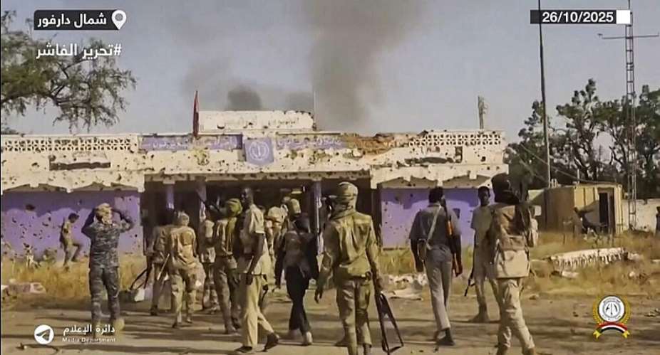Sudans paramilitary Rapid Support Forces (RSF) fighters holding weapons and celebrating in the streets of El-Fasher in Sudans Darfur in 2025. -  AFP