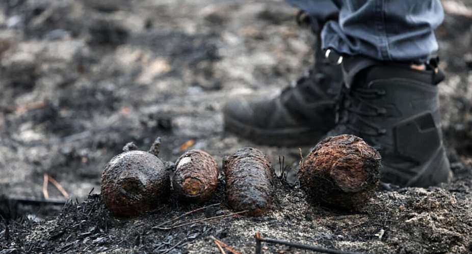 This photograph shows shells from World War II in the village of Le Porge, which were uncovered during wildfires in the south-western France on 3 August 2026. -  AFP - ROMAIN PERROCHEAU