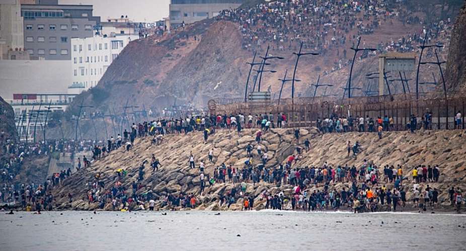 Migrants return to Morocco from the Spanish enclave of Ceuta, 31 July. - AP Photo/Antonio Sempere - Antonio Sempere