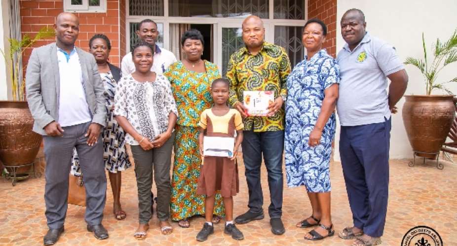Ablakwa awards 8-year-old winner of Volta Regional reading competition scholarship up to University