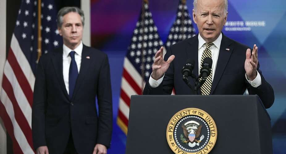 President Joe Biden speaks as Secretary of State Antony Blinken looks on. - Source: Photo by Alex WongGetty Images