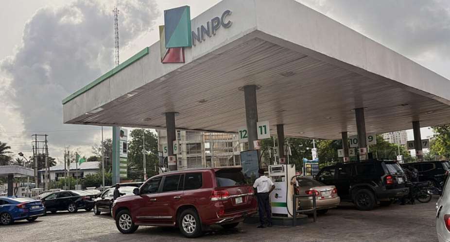 People buying fuel at a petrol station in Lagos, Nigeria, in March 2026. - AP - Sunday Alamba