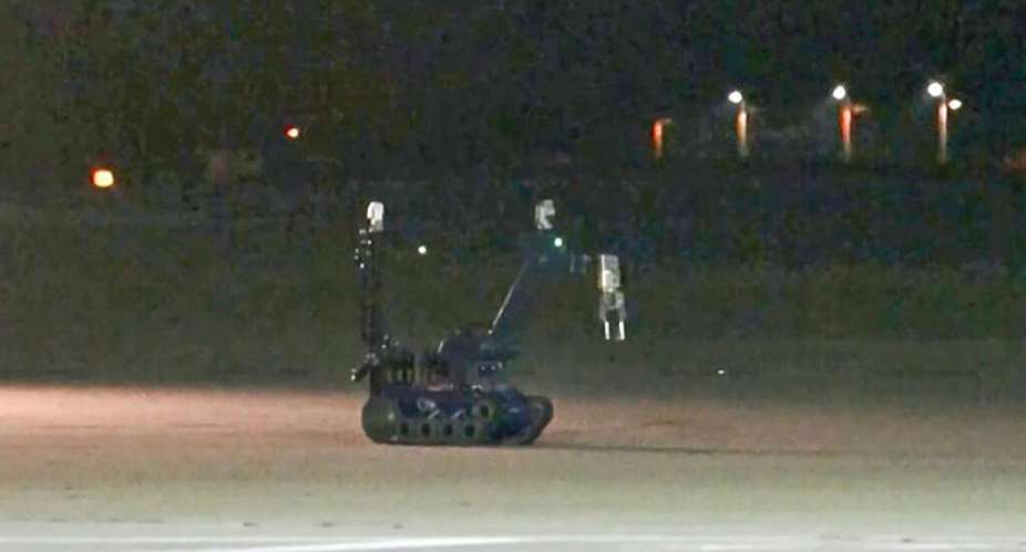 An image from video footage taken by News5 shows a bomb disposal robot at German airport Leipzig-Halle after a drone was spotted nearby. -  NEWS5/AFP