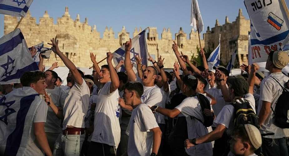 Israelis celebrate near Damascus Gate during the annual Jerusalem Day march commemorating Israels capture of East Jerusalem in 1967, 14 May. - AP Photo/Leo Correa - Leo Correa