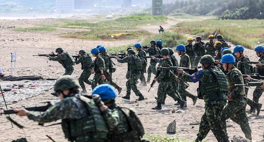Taiwan military personnel conduct a live-fire exercise on Zhongfu Beach as part of the annual Han Kuang military exercise. -  I-Hwa Cheng, AFP
