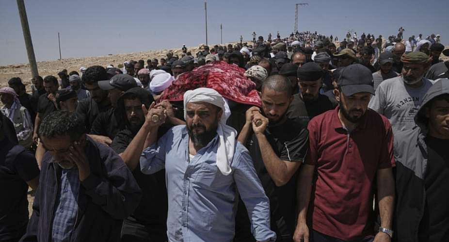 Mourners carry the body of Palestinian activist Awdah Al Hathaleen during his funeral in the West Bank Bedouin village of Umm al Khair on August 7, 2025. -  Mahmoud Illean, AP