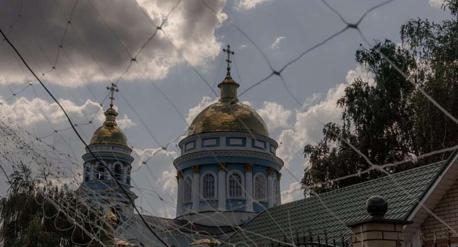 A file image of the Holy Ascension Cathedral seen through anti-drone nets in the town of Izium, in the eastern Kharkiv region, on July 22, 2026. -  Roman Pilipey, AFP